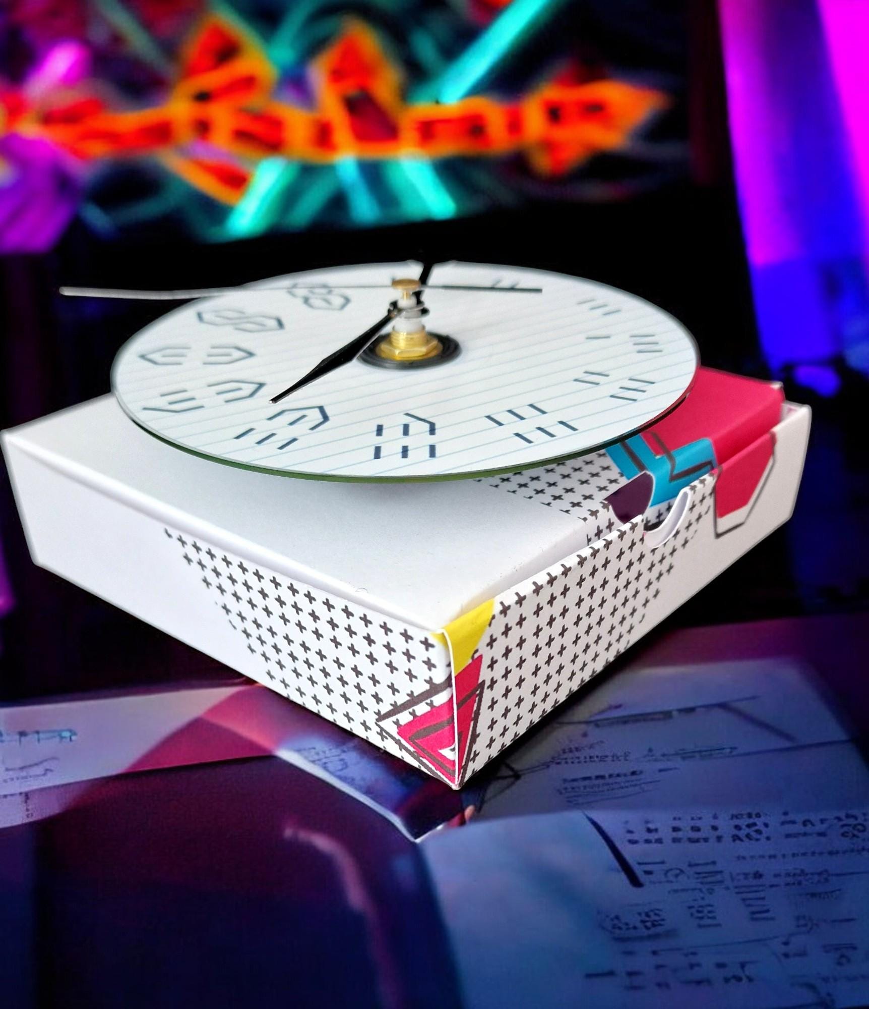 Gift boxed wall clock made from a CD with the 90s graffiti “S” design, displayed as a unique retro gift.
