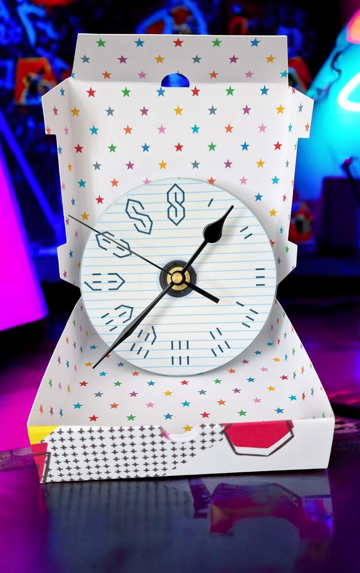 Gift boxed wall clock made from a CD with the 90s graffiti “S” design, displayed as a unique retro gift.