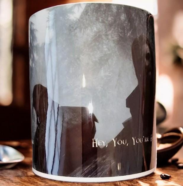 Black color change mug with “Hey you’re finally awake” Ralof design revealed by heat, shown as a fun gamer and coffee lover gift.