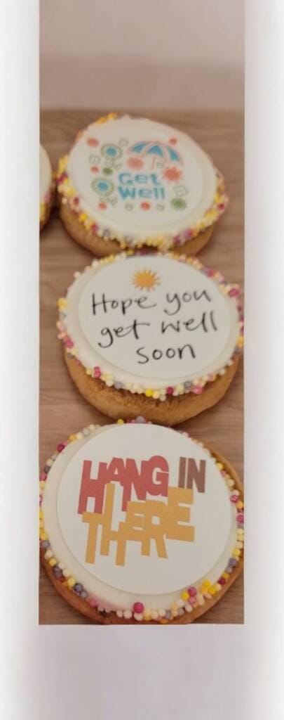 Box of personalised chocolate chip cookies with colourful edible toppers and sprinkles – get well soon pick me up gift