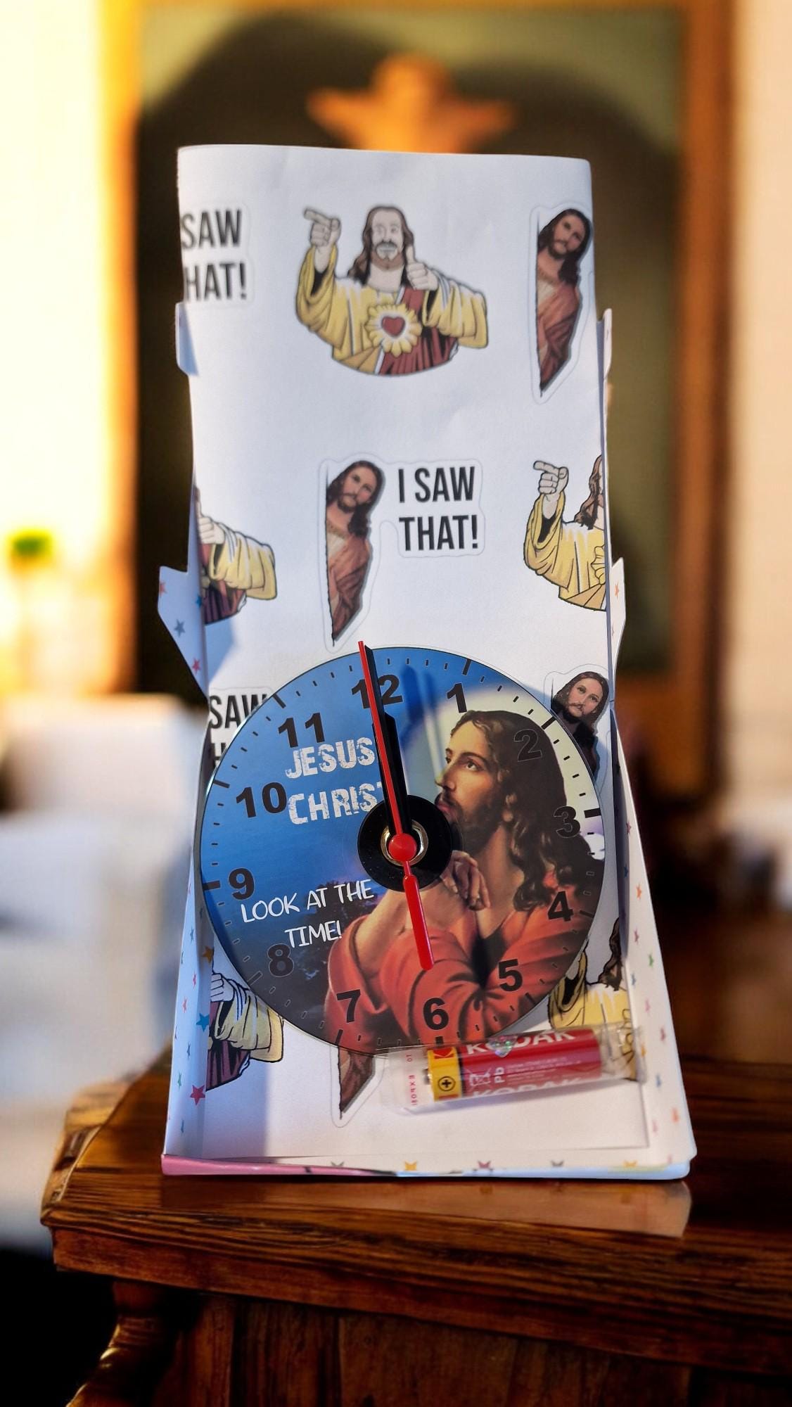 Gift boxed CD wall clock with “Jesus Christ Look at the Time” design, displayed as a unique and humorous home decor gift.