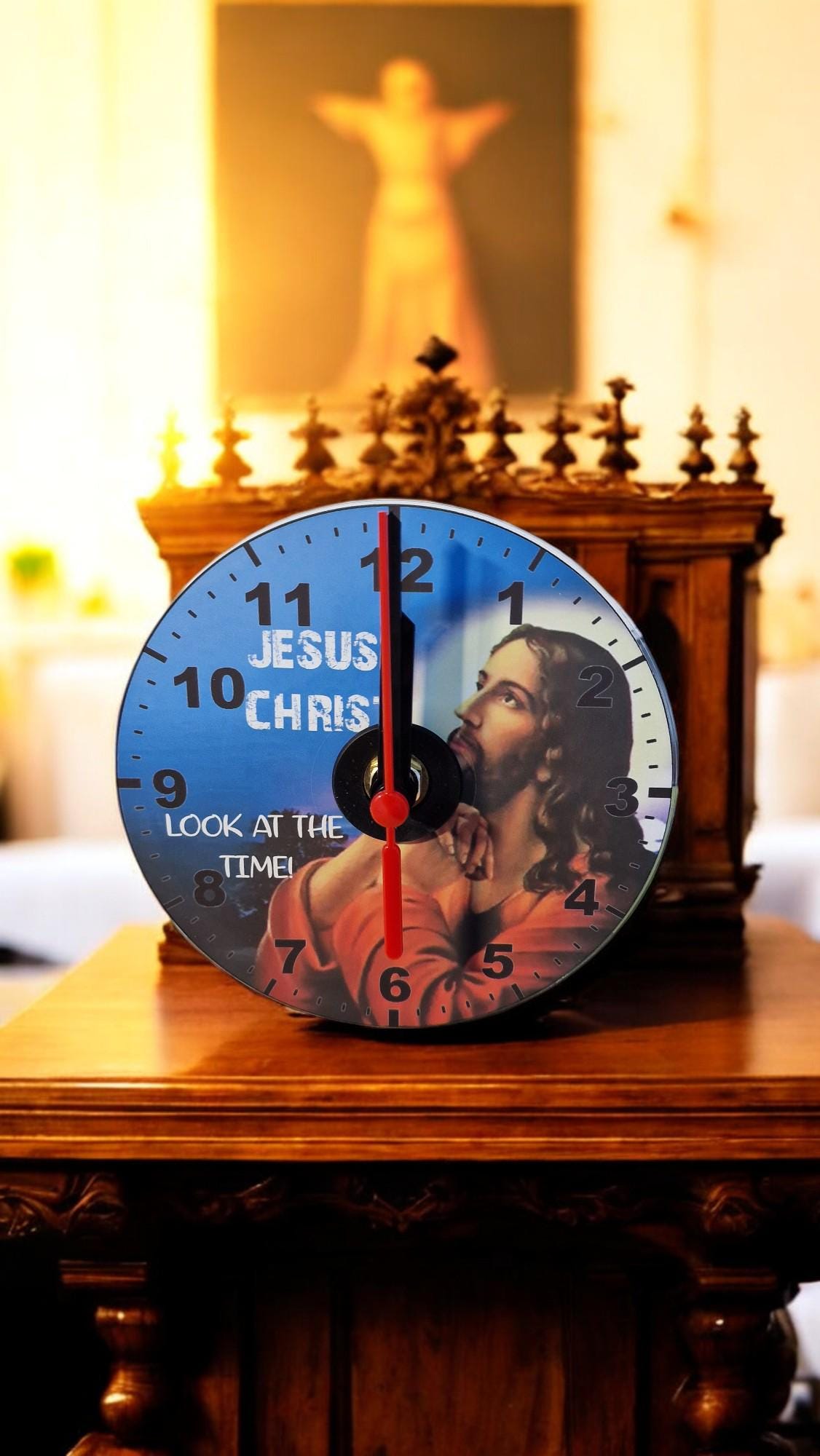 Gift boxed CD wall clock with “Jesus Christ Look at the Time” design, displayed as a unique and humorous home decor gift.