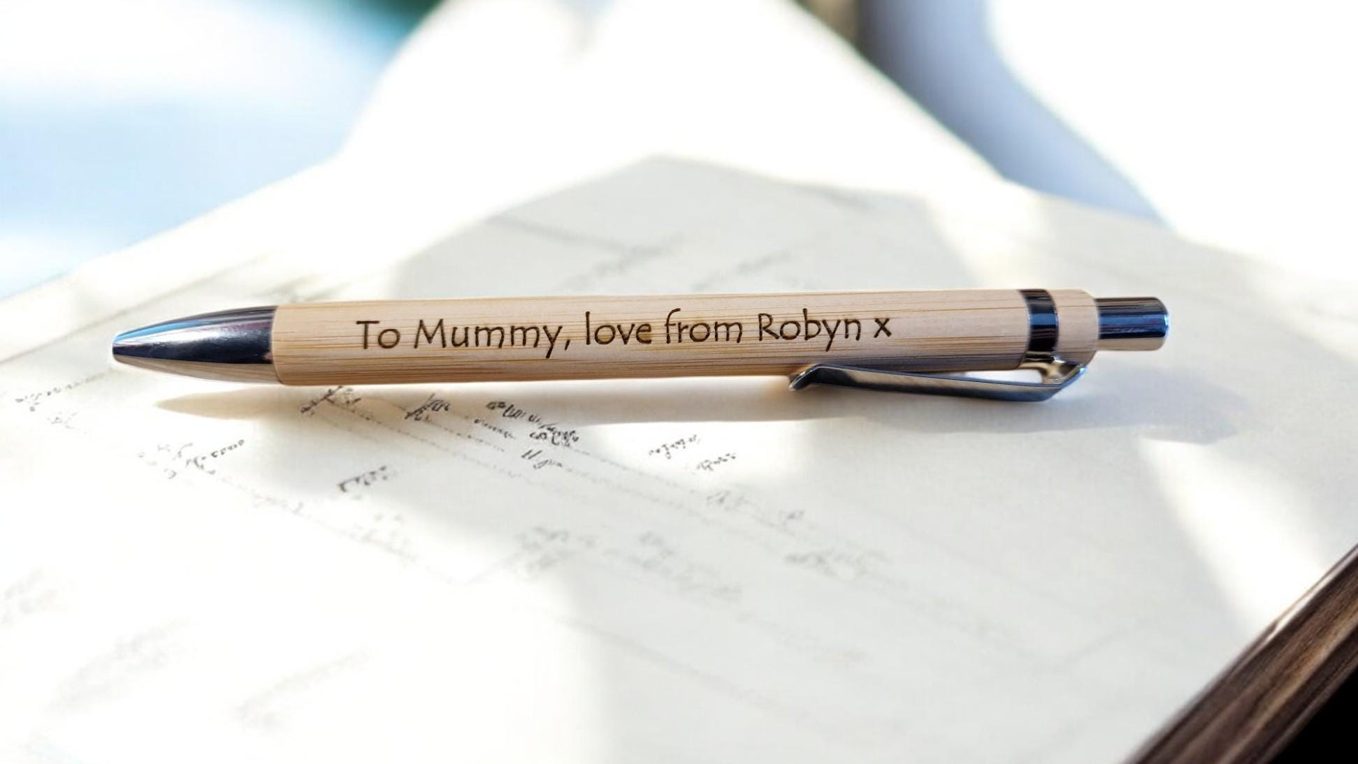 Black engraved novelty pen with custom name, ideal for personalised office gifts, Secret Santa, or stocking fillers.