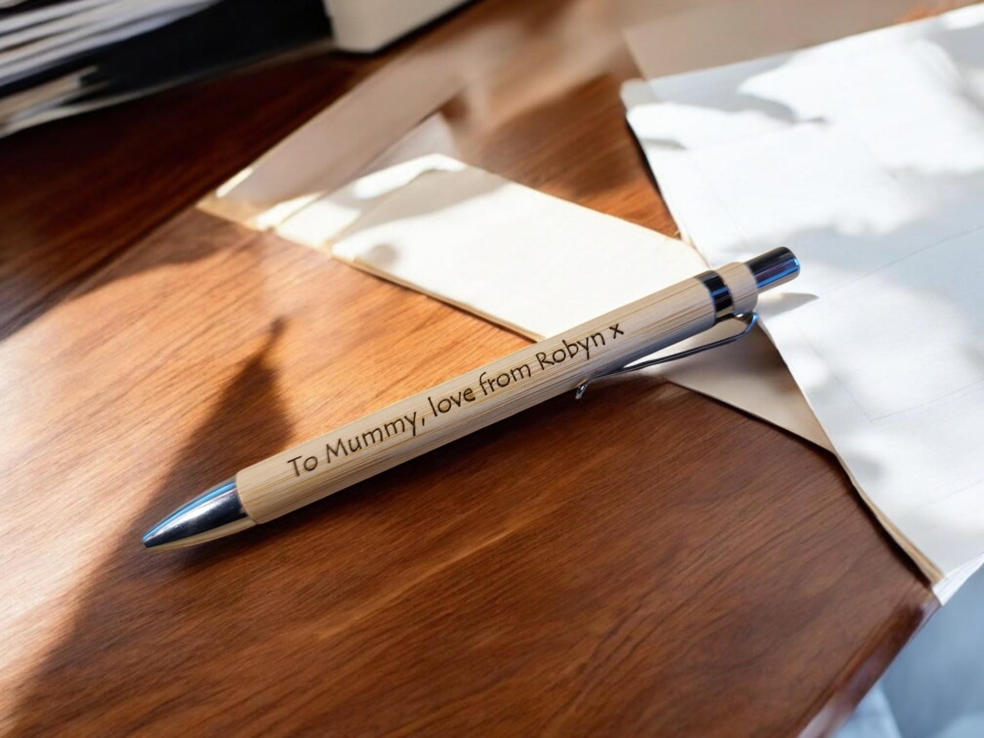 Black engraved novelty pen with custom name, ideal for personalised office gifts, Secret Santa, or stocking fillers.