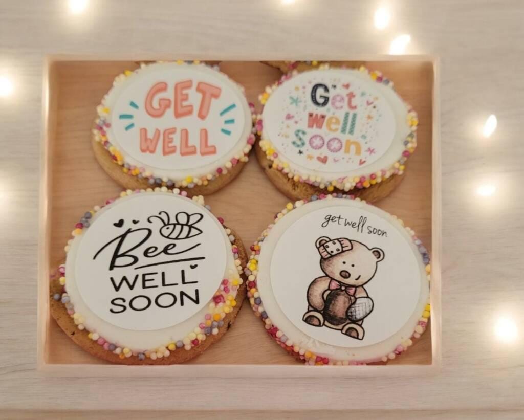 Box of personalised chocolate chip cookies with colourful edible toppers and sprinkles – get well soon pick me up gift