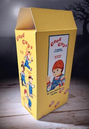 Chucky-themed socks in a Good Guys box with vegan edible cake toppers – perfect horror movie Halloween gift