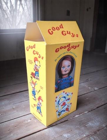 Chucky-themed socks in a Good Guys box with vegan edible cake toppers – perfect horror movie Halloween gift