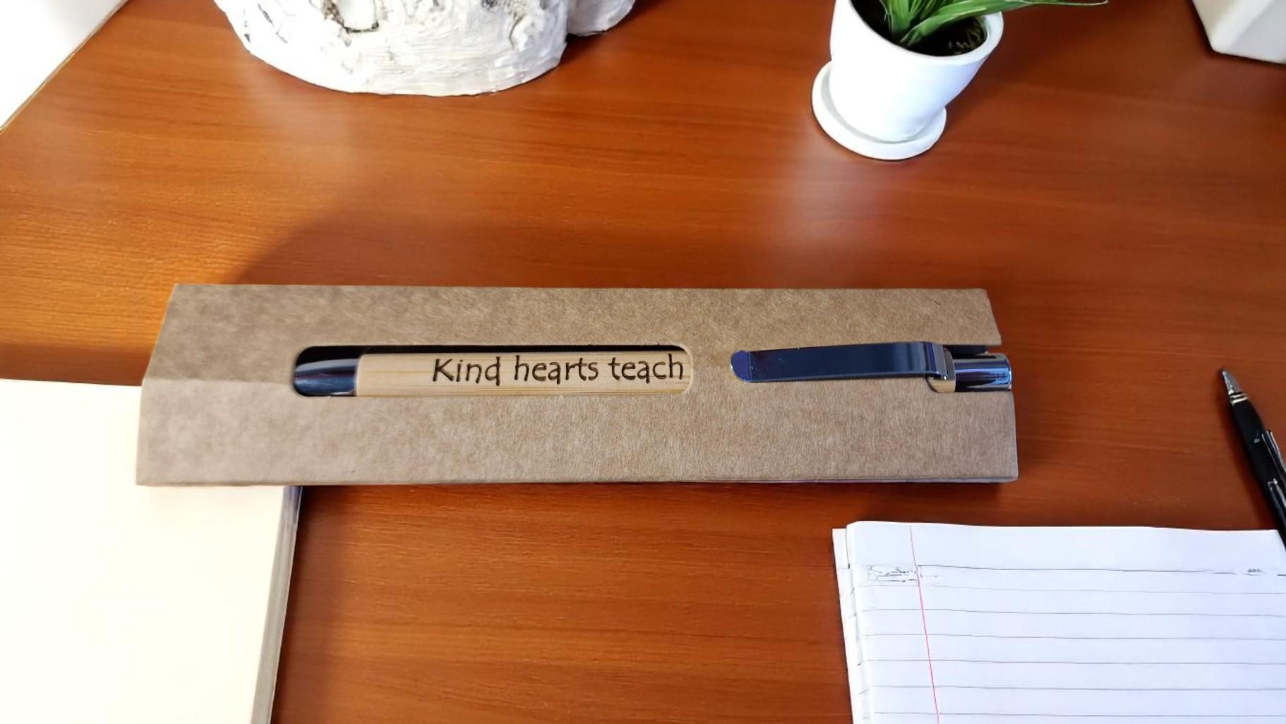 Personalised bamboo black pen with engraved custom message, eco-friendly and perfect for teachers, students, colleagues, or graduation gifts.