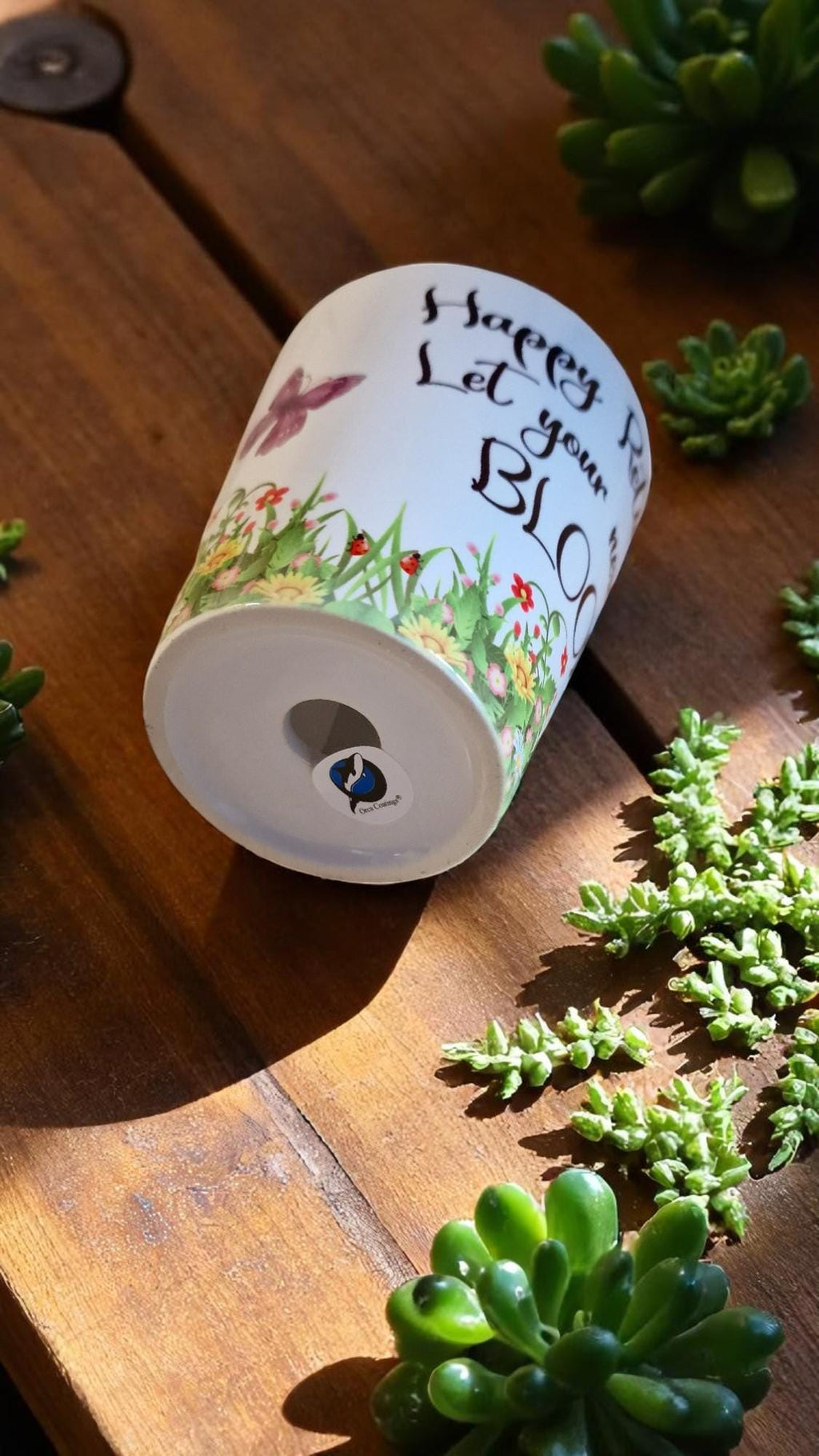 Personalised ceramic plant pot with “Happy Retirement – Let Your New Life Bloom” message, ideal as a leaving gift.