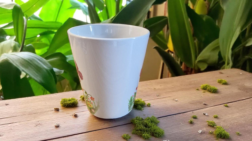 Personalised ceramic plant pot with “Happy Retirement – Let Your New Life Bloom” message, ideal as a leaving gift.