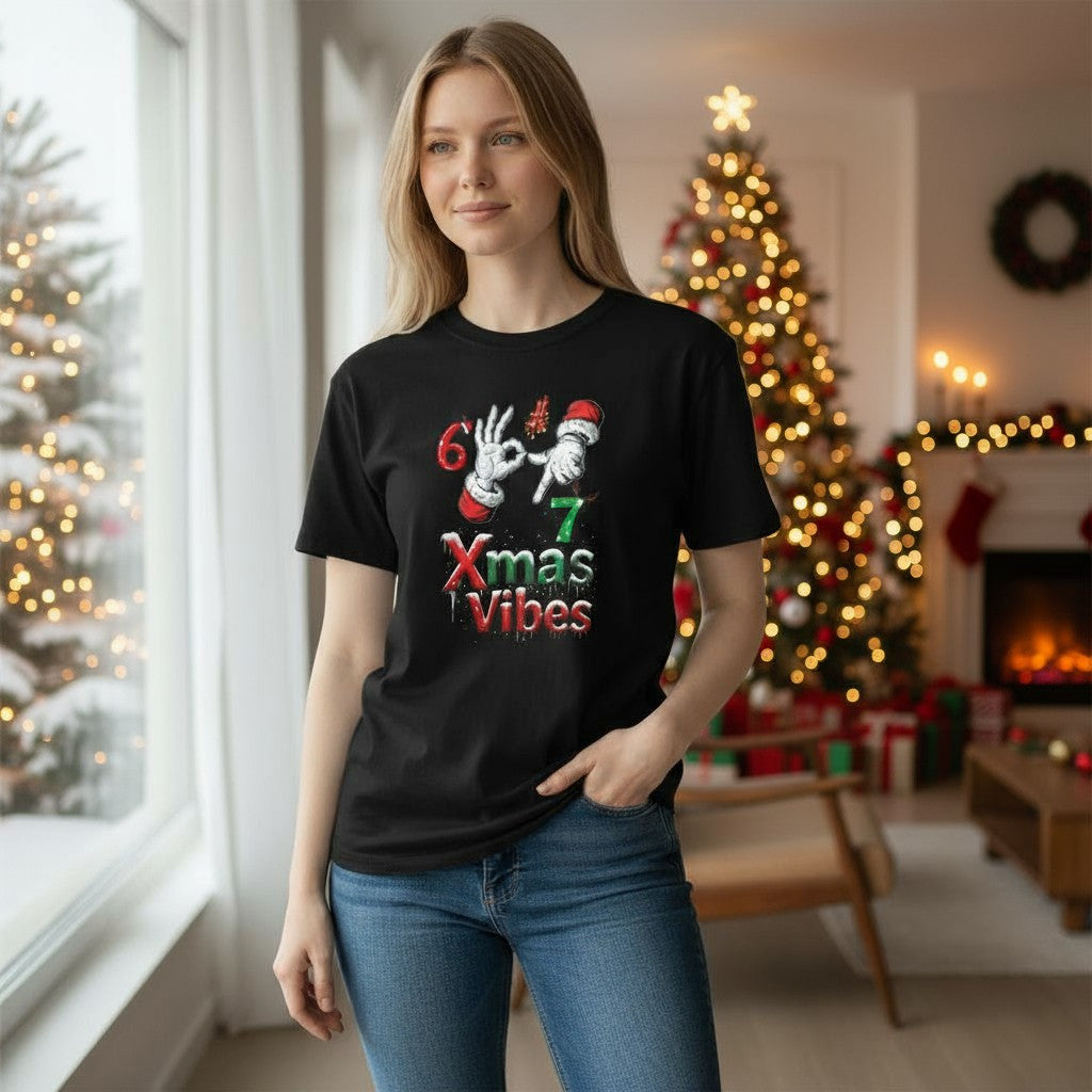 Woman wearing a black t-shirt with Christmas-themed design in a festive room.