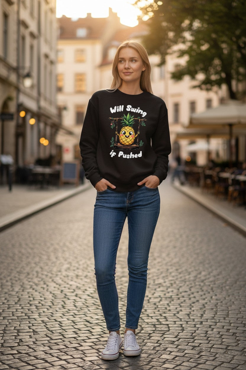 Woman wearing a black sweatshirt with text and graphics on a street.