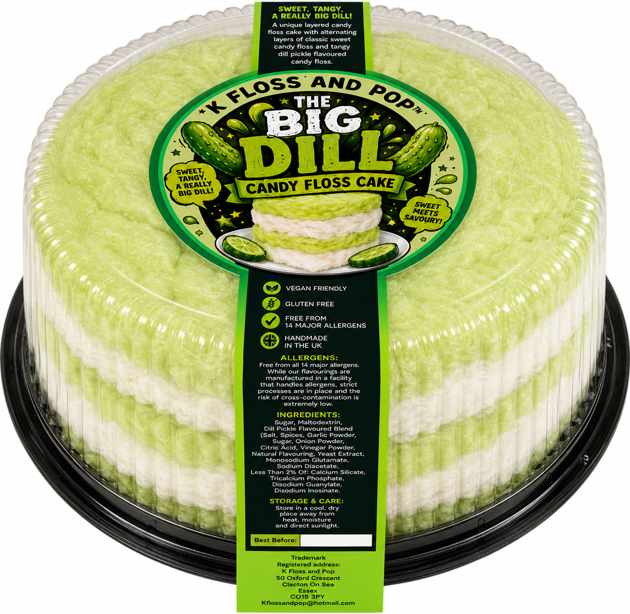 A packaged round cake in a clear plastic tub with a black base, featuring a bright yellow-green and white striped sponge cake. The cake is wrapped in a clear plastic cover with a large green and black label reading "The Big Dill Candy Floss Cake" and a dark green vertical label with product details.