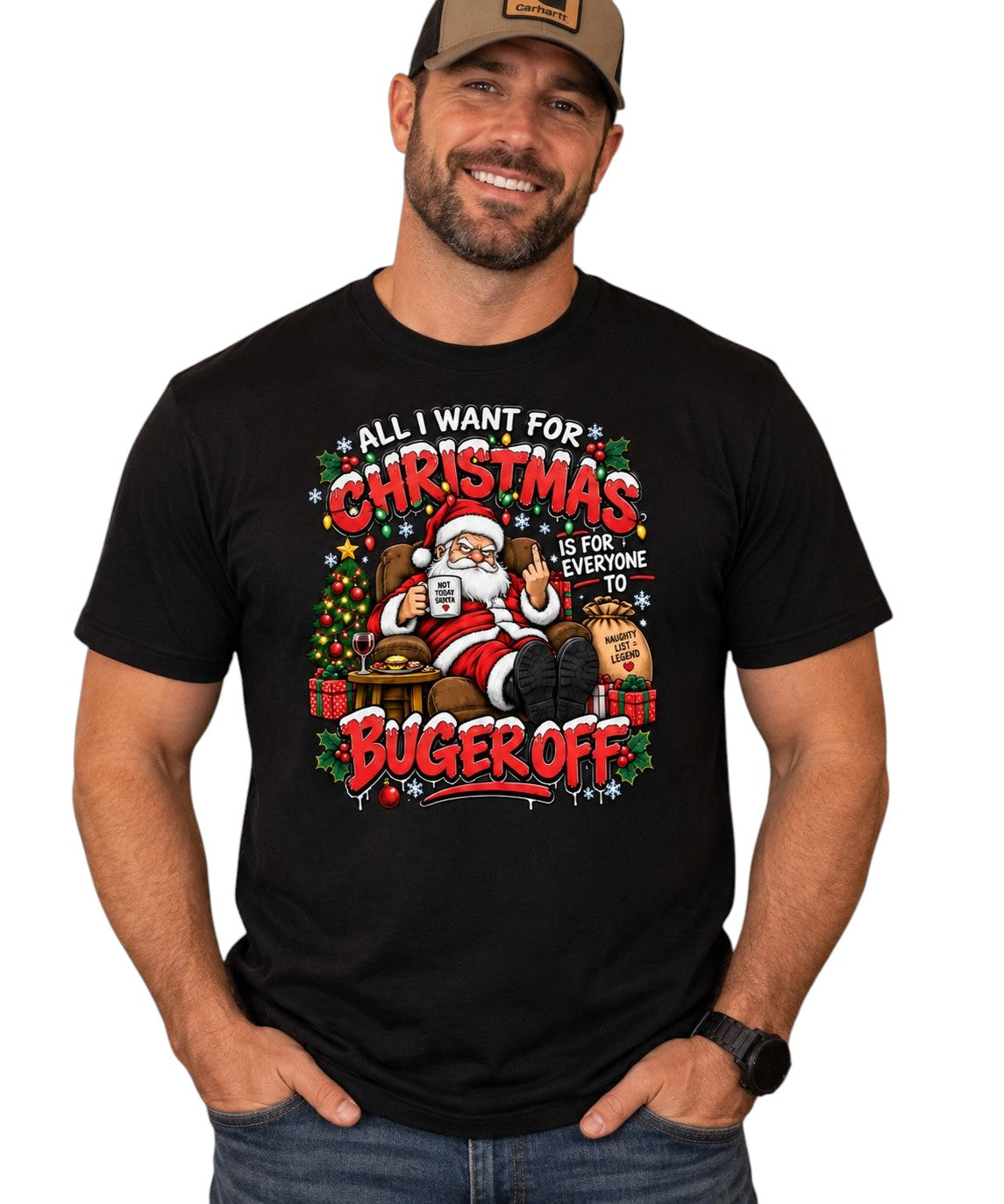 A man wearing a black graphic t-shirt with a colorful Christmas-themed design that reads 'ALL I WANT FOR CHRISTMAS IS FOR EVERYONE TO BUGER OFF'.
