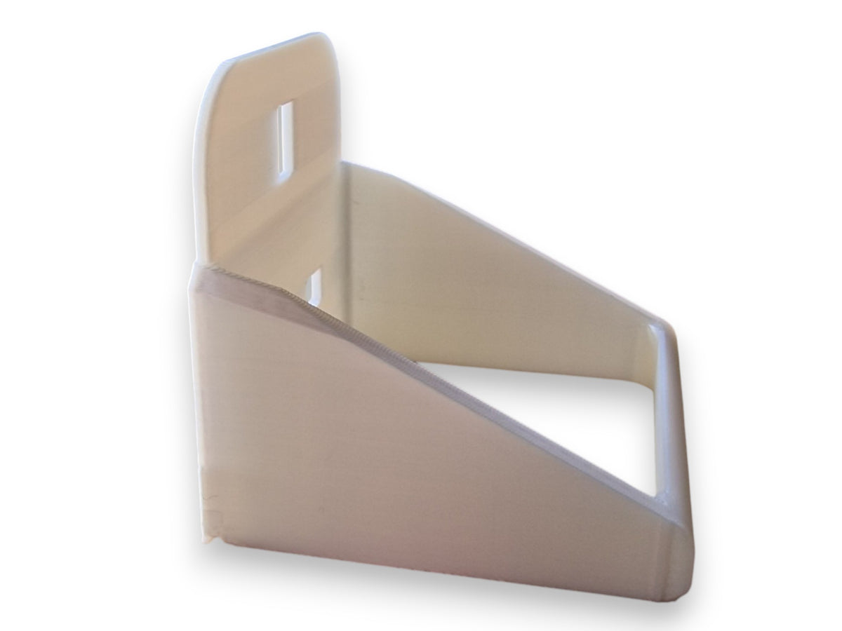 A light beige plastic triangular shelf or mount with a vertical backplate and two rectangular cutouts, shown on a plain white background.