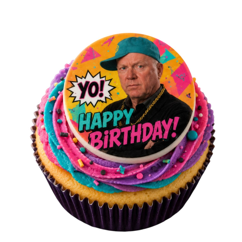Cupcake with colorful frosting and a character-themed topper on a white background