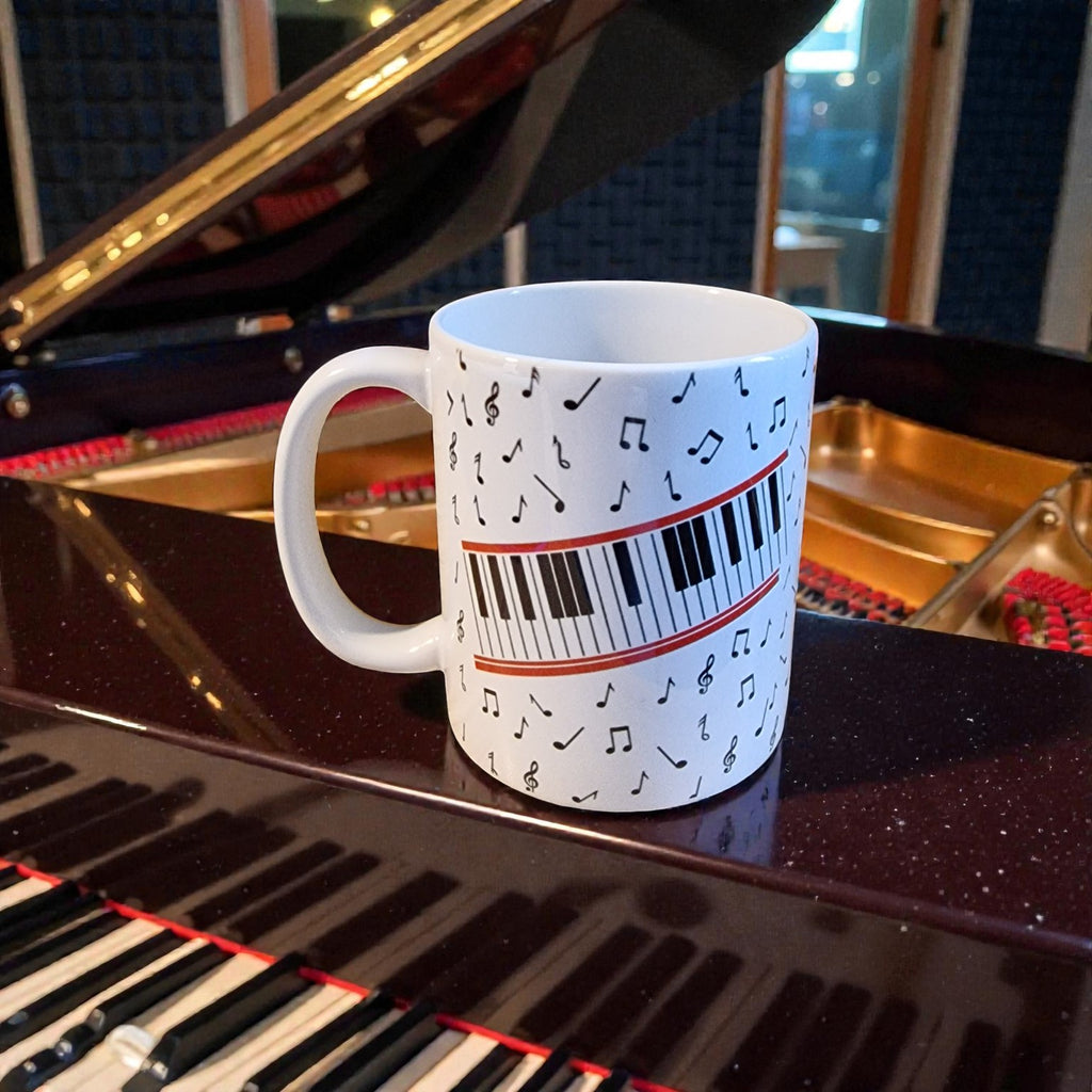 Mug with musical notes and piano keys design on a grand piano