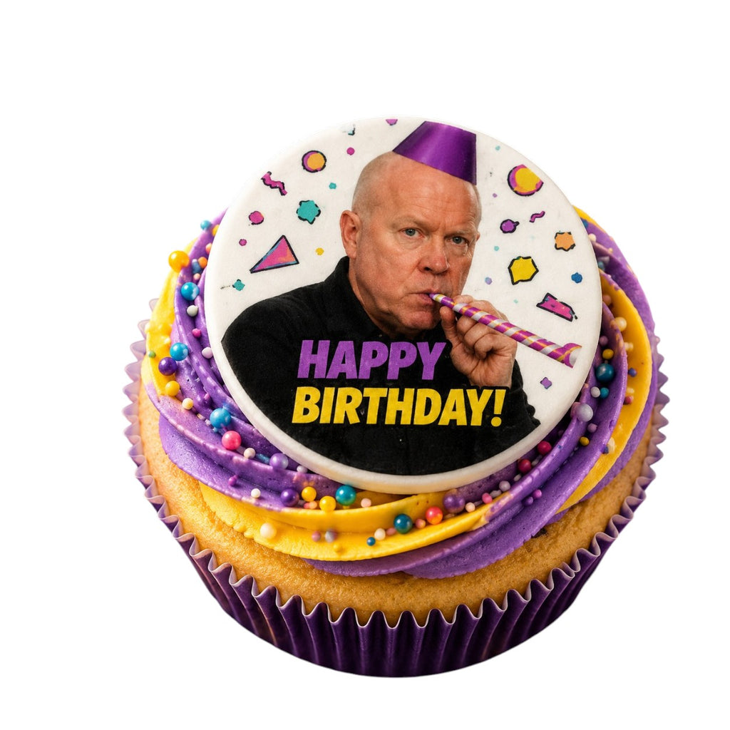 Cupcake with a birthday-themed topper featuring a face and 'Happy Birthday!' text on a white background.