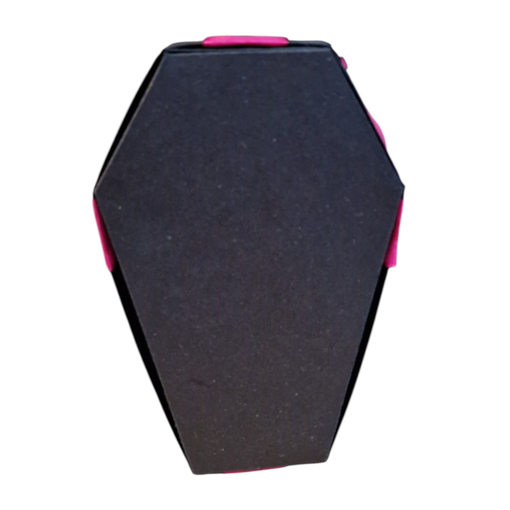 A coffin-shaped black foam block or cushion with bright pink trim and side accents, shown against a plain white background.