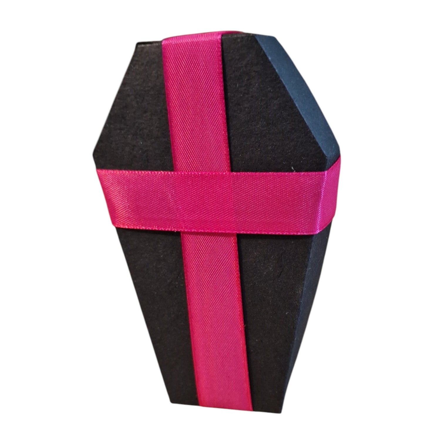 A coffin-shaped black box with a bright pink satin ribbon wrapped in a cross pattern, isolated on a white background.