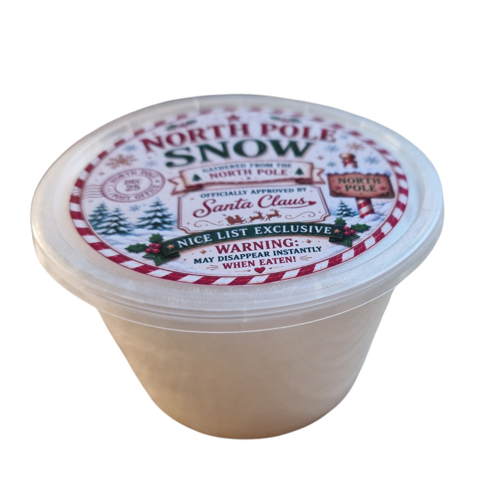 Container labeled 'North Pole Snow' with festive design on a white background