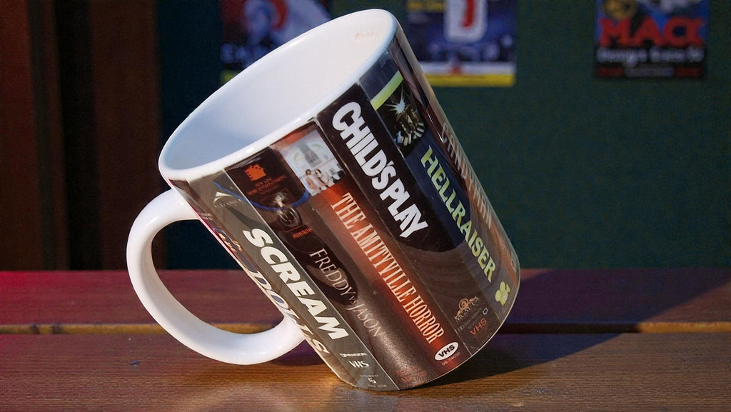 Mug with horror movie poster design on a wooden surface