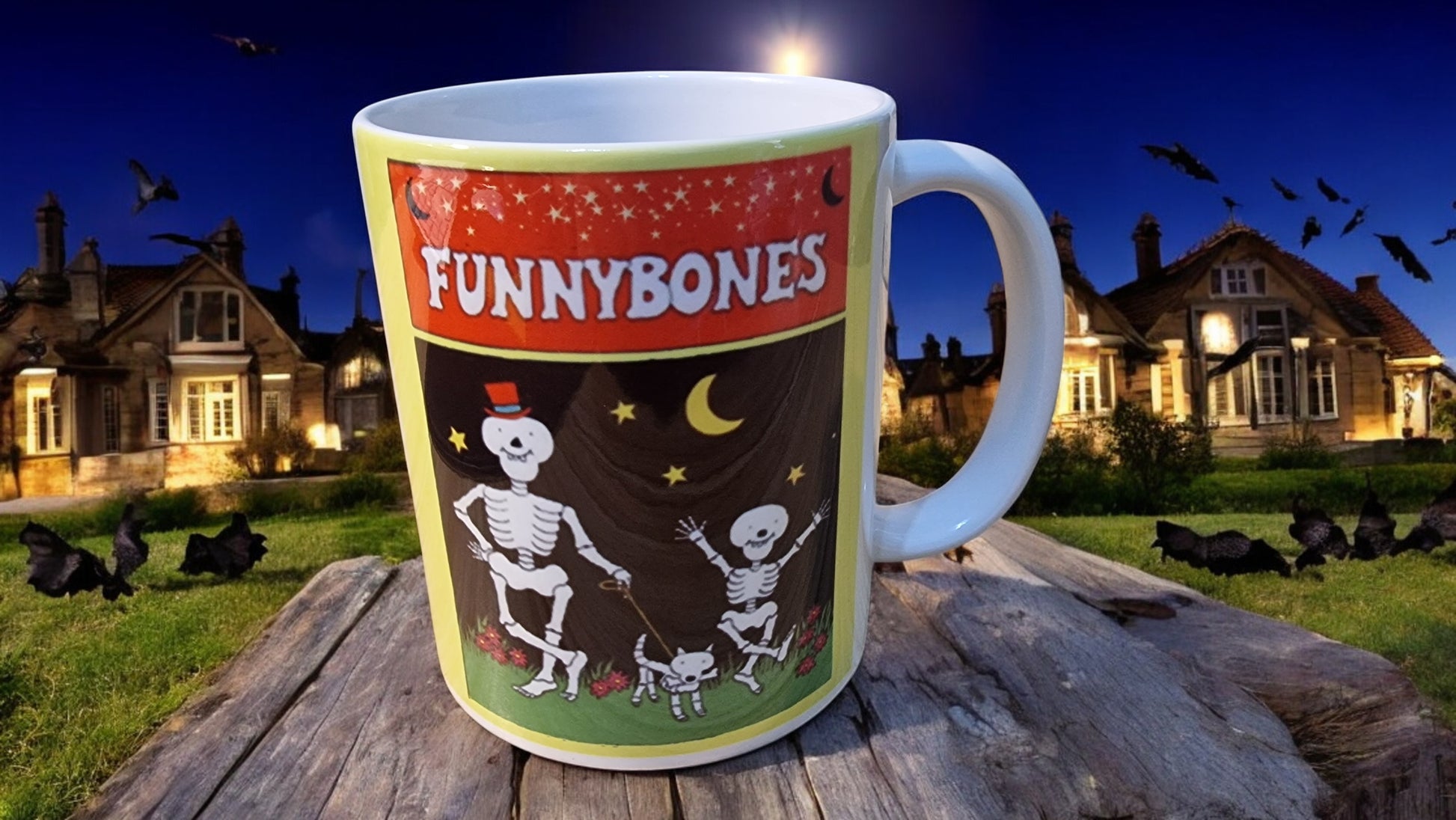 Mug with 'Funnybones' design on a wooden surface at night with Halloween decorations.